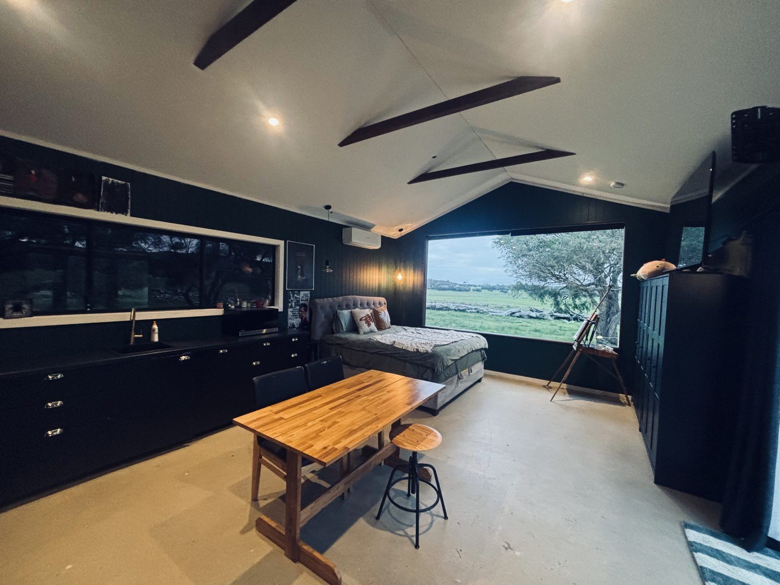 The studio — kitchen, dining and bed in one room