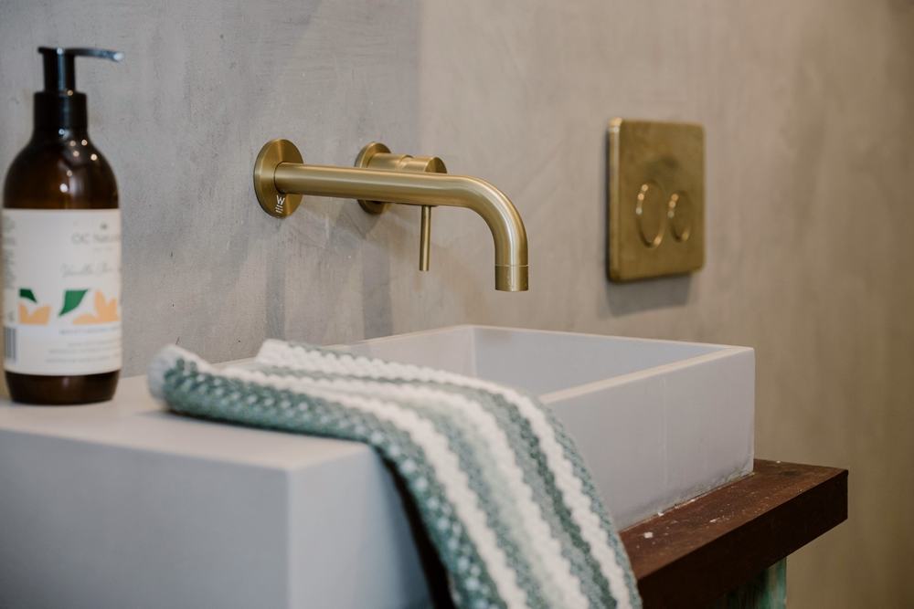 Wall-hung basin with brass tapware