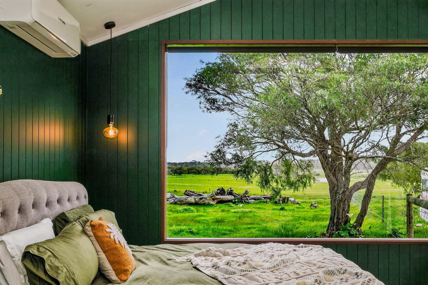 The bed and the picture window looking out over the paddock